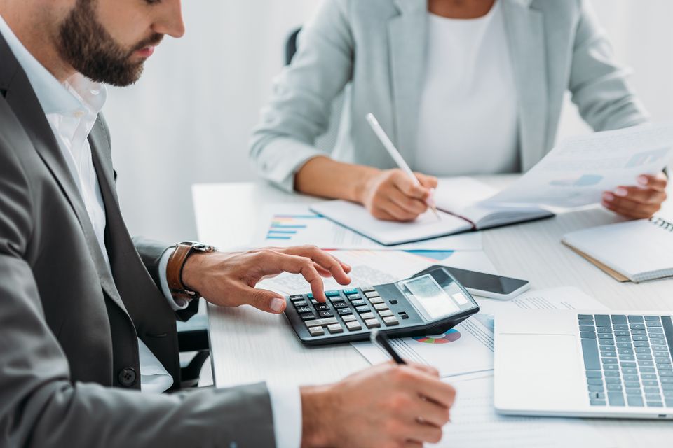 Accountant preparing financial statements and reports for a Dallas small business