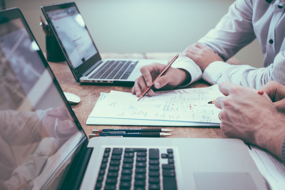 CPA reviewing IRS notices and tax resolution paperwork at a desk